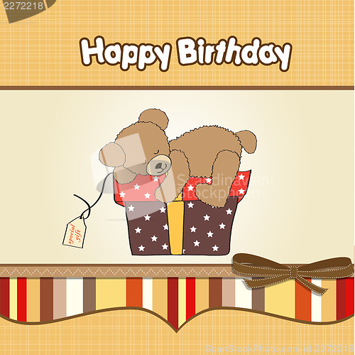 Image of birthday greeting card with teddy bear and big gift box