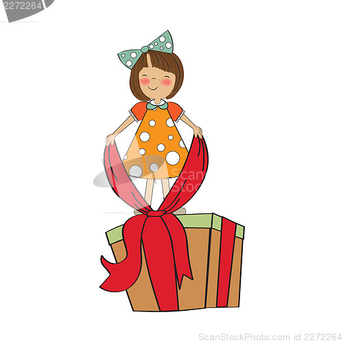 Image of a nice girl with a big gift box