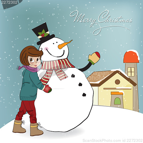 Image of Cute little girl with snowman