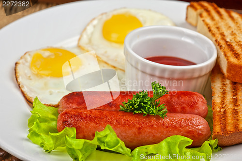 Image of Fried eggs with sausages