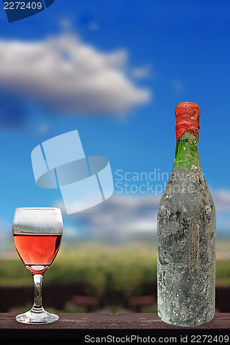 Image of old red wine and glass