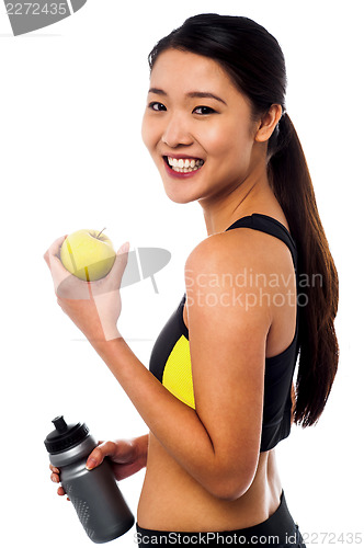 Image of Eat healthy, stay fit. Smiling chinese girl