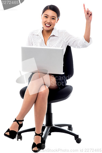 Image of Attractive woman working on laptop