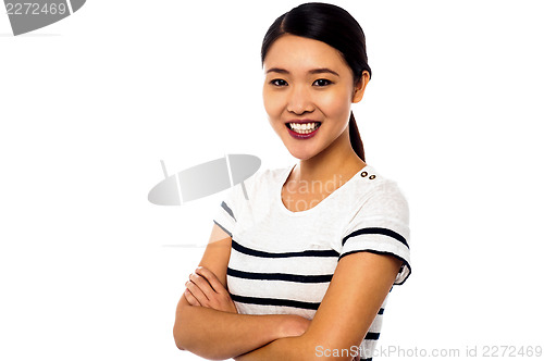 Image of Pretty asian girl posing sweetly with confidence