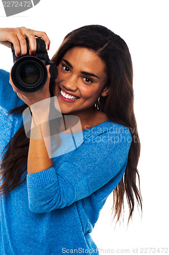 Image of Woman taking a snap, smile please