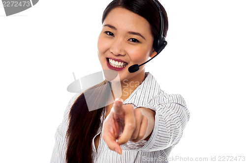 Image of Call centre support staff pointing towards camera