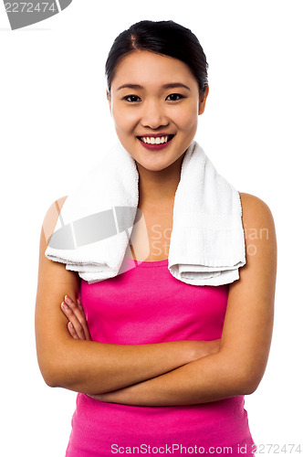 Image of Fit smiling woman with towel around her neck