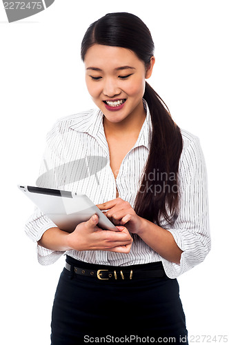 Image of Corporate woman brwosing on tablet pc