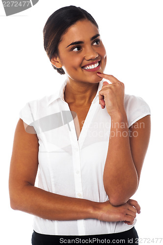 Image of Woman thinking something and smiling