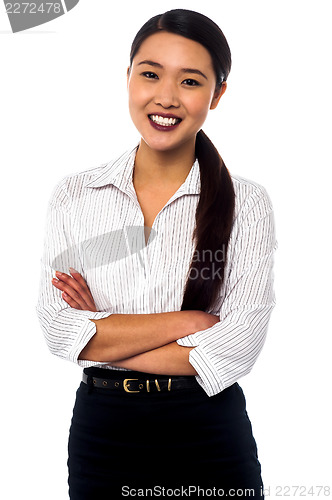 Image of Female secretary posing with arms crossed