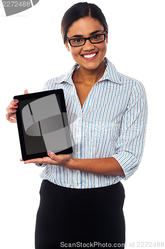 Image of Sales representative displaying tablet pc for sale