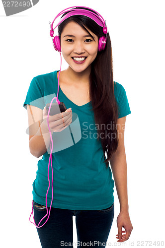 Image of Pretty girl listening to music