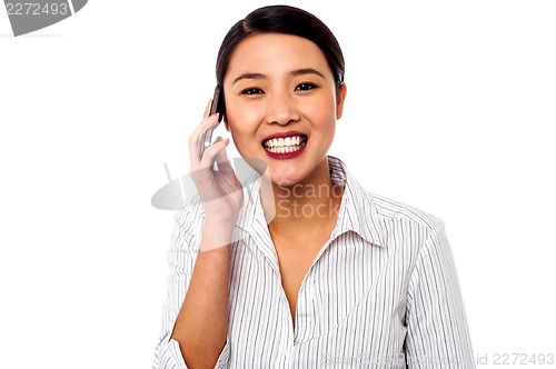 Image of Business woman closing deal over a phone call