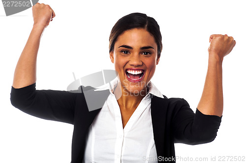 Image of Excited woman with clenched fists