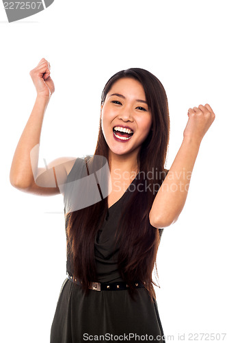 Image of Excited woman with clenched fists