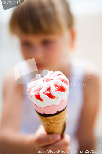 Image of Ice cream held by young girl
