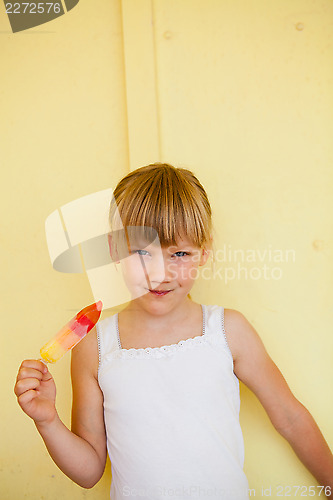 Image of Young girl holding with popsicle