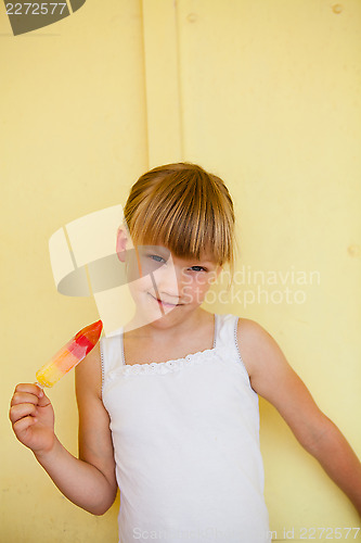 Image of Young girl holding with popsicle