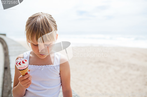 Image of Girl with ice cream near beach