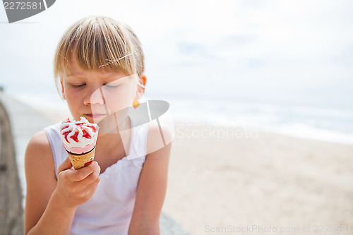 Image of Girl with ice cream near beach