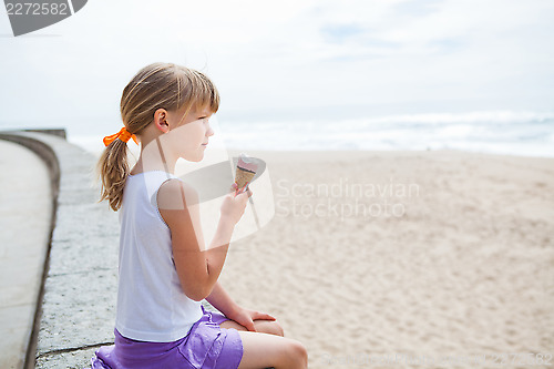 Image of Girl with ice cream near beach