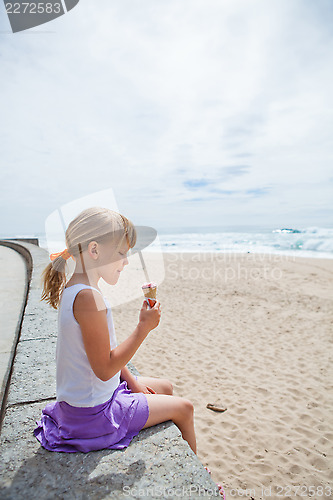 Image of Girl with ice cream near beach