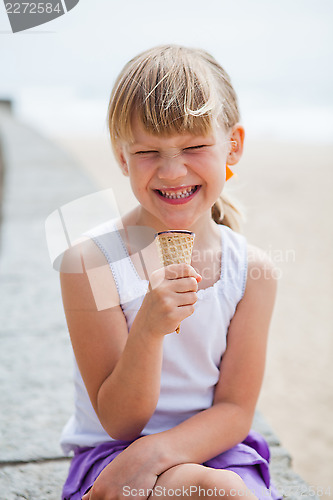 Image of Girl with ice cream near beach