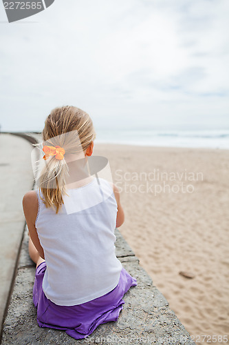 Image of Young girl relaxing at beach