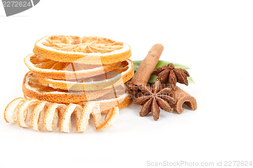 Image of Dried orange, Star Anise, cinnamon and and green leave