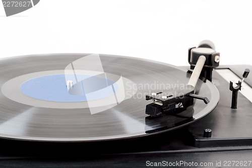 Image of Spinning vinyl record. Motion blur image.  Vintage toned. 