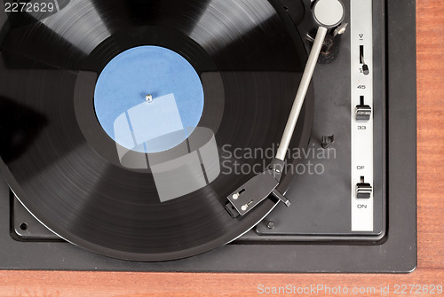 Image of Spinning vinyl record. Motion blur image.  Vintage toned. 