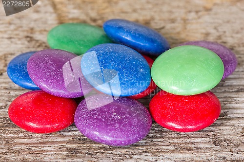 Image of Colorful candy on the wooden background