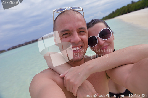 Image of happy young couple have fun on summer