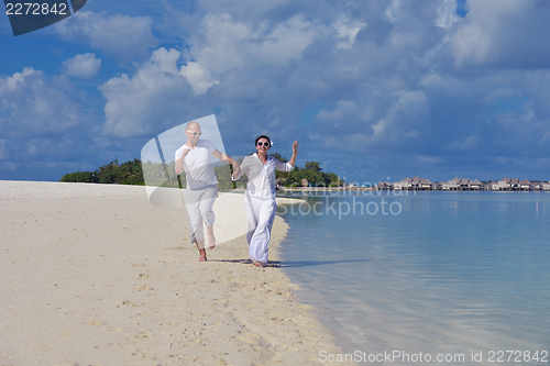 Image of happy young couple have fun on summer