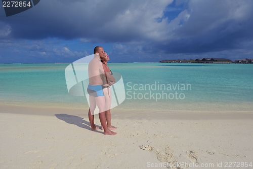 Image of happy young couple have fun on summer