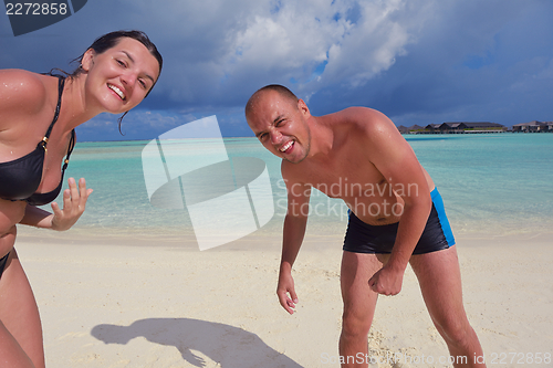 Image of happy young couple have fun on summer