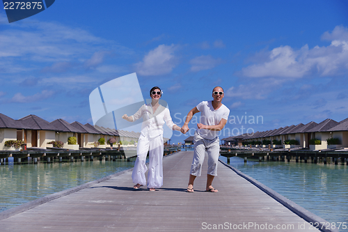 Image of happy young couple have fun on summer