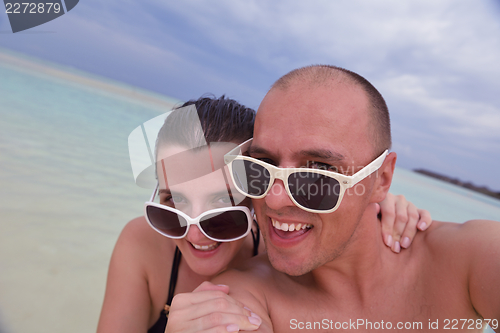 Image of happy young couple have fun on summer