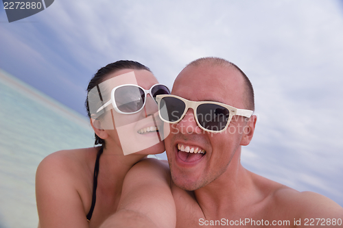 Image of happy young couple have fun on summer
