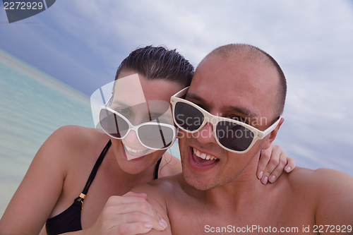 Image of happy young couple have fun on summer