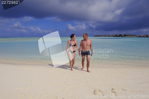 Image of happy young couple have fun on summer
