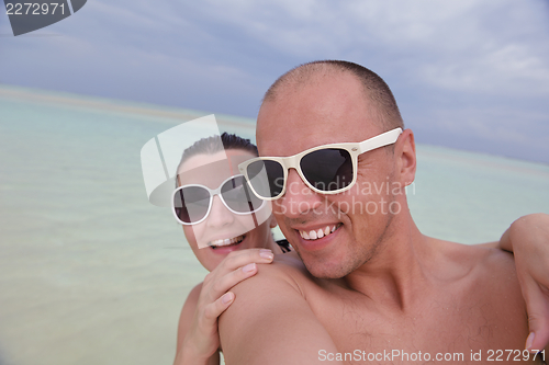 Image of happy young couple have fun on summer