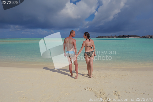 Image of happy young couple have fun on summer