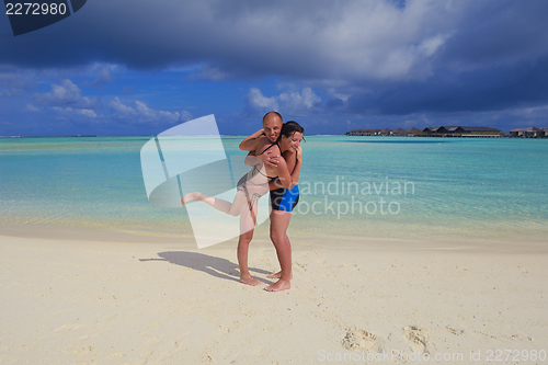 Image of happy young couple have fun on summer