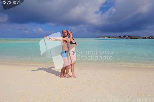 Image of happy young couple have fun on summer