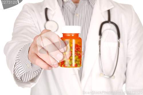 Image of Doctor With Medication in Prescription Bottles