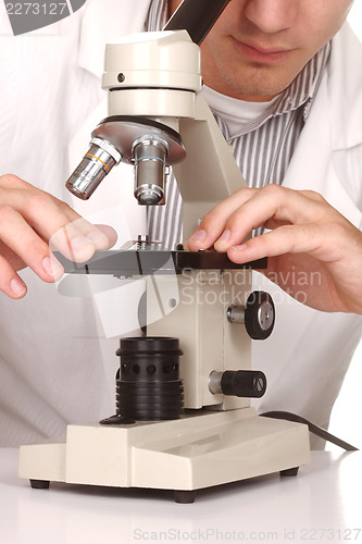 Image of Caucasian Scientist At Work Using the Scientific Method