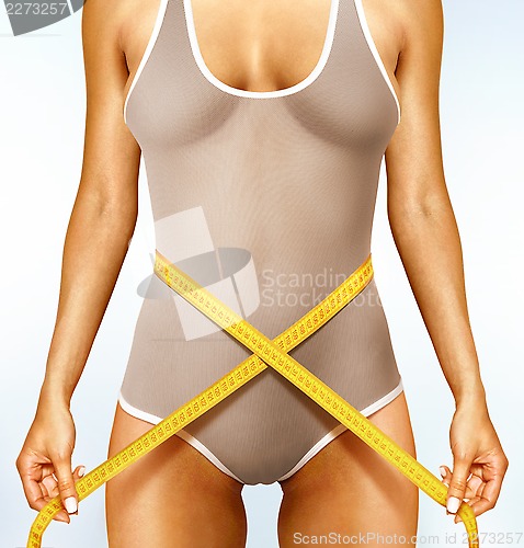 Image of woman measuring perfect shape l