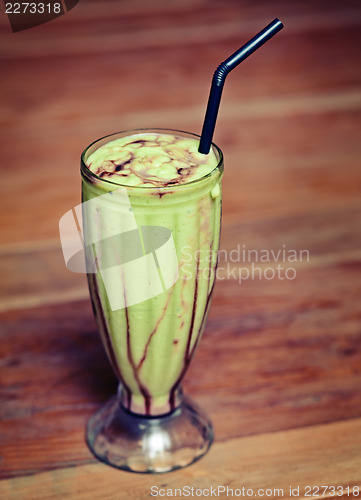 Image of Fruit shake in a glass on the table -  exotic drink.