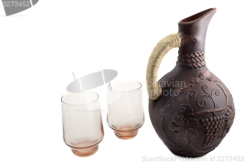 Image of Ceramic jug for wine from red clay on a white background